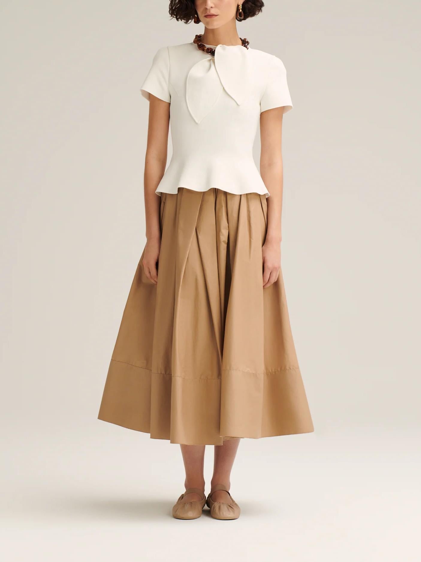 Women's cream crepe knit cravat top, side view
