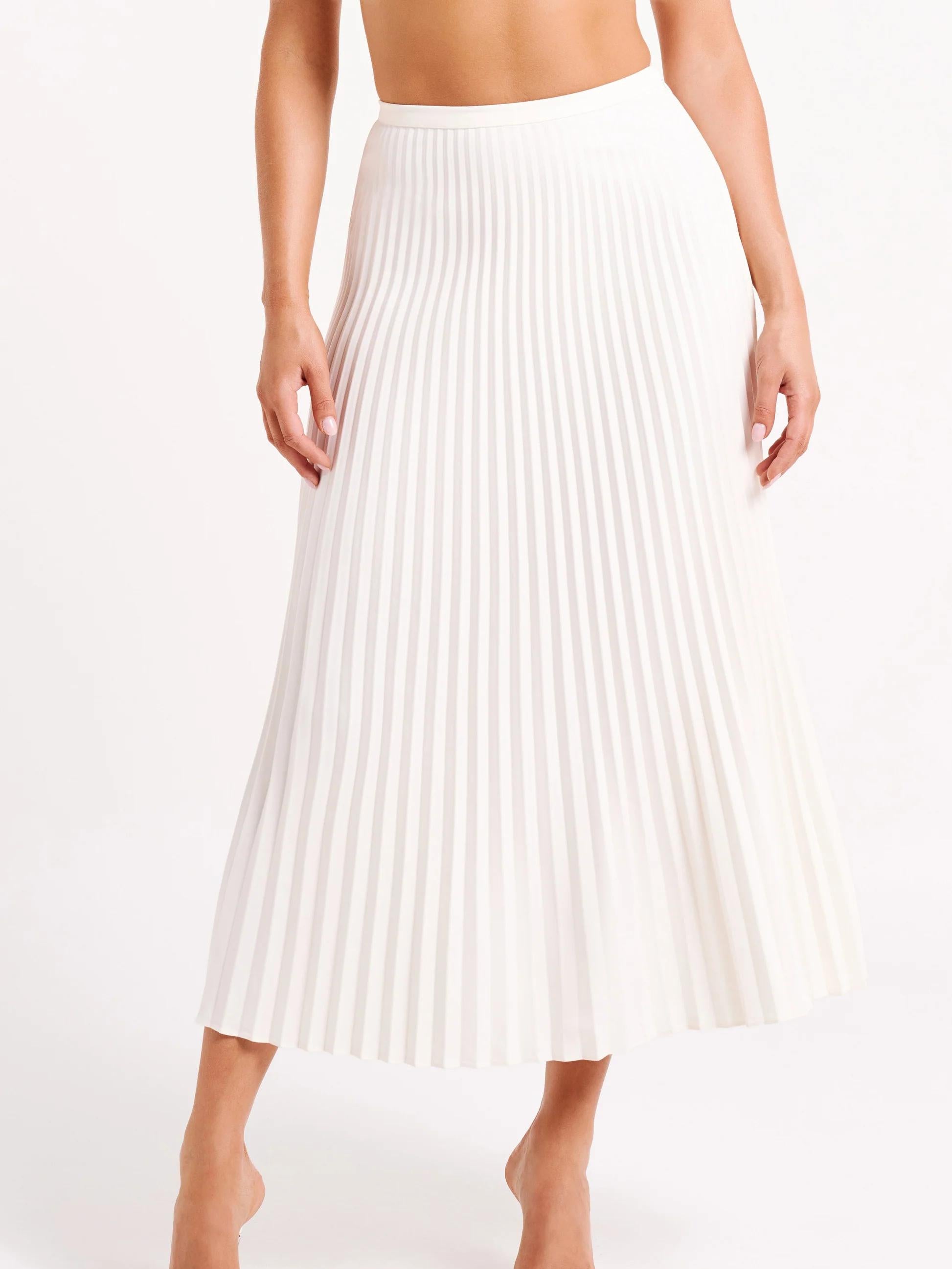 Women's cream cravat top and pleated maxi skirt set, back view