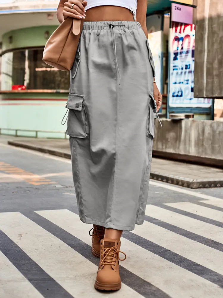 Women's denim cargo midi skirt with drawstring waist and pockets — worn view
