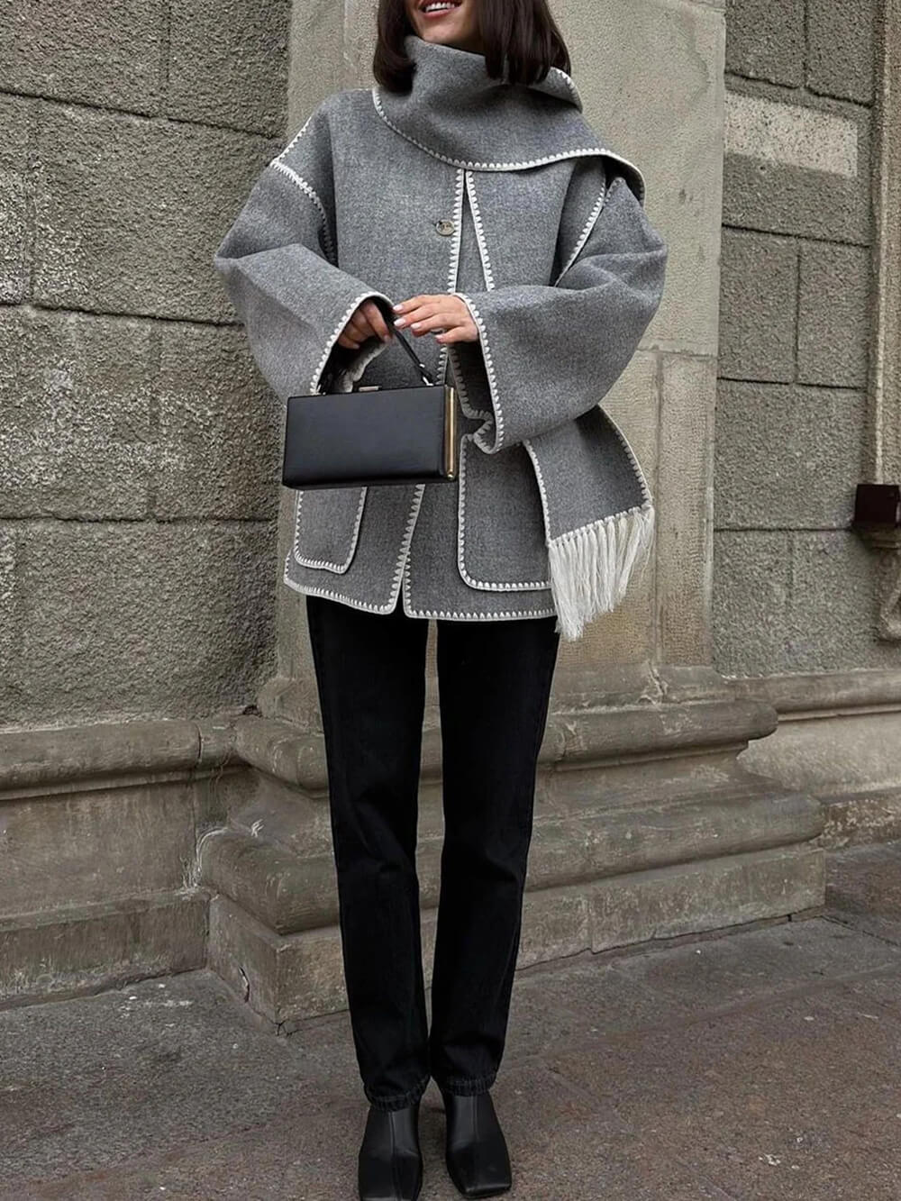 Women's draped fringed wrap jacket — close-up detail