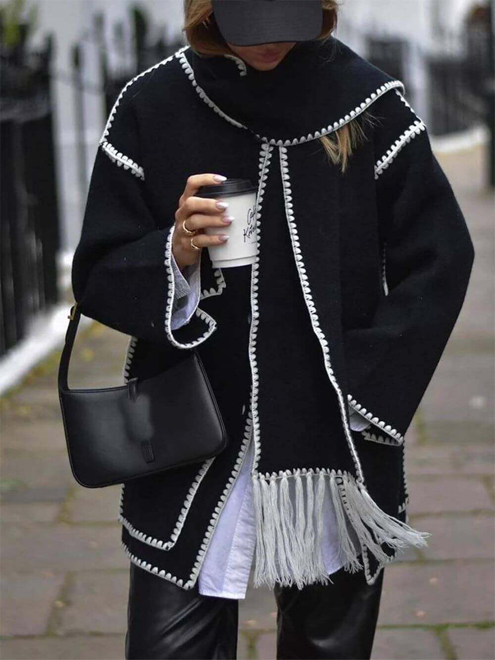 Women's draped fringed wrap jacket — close-up fringe detail