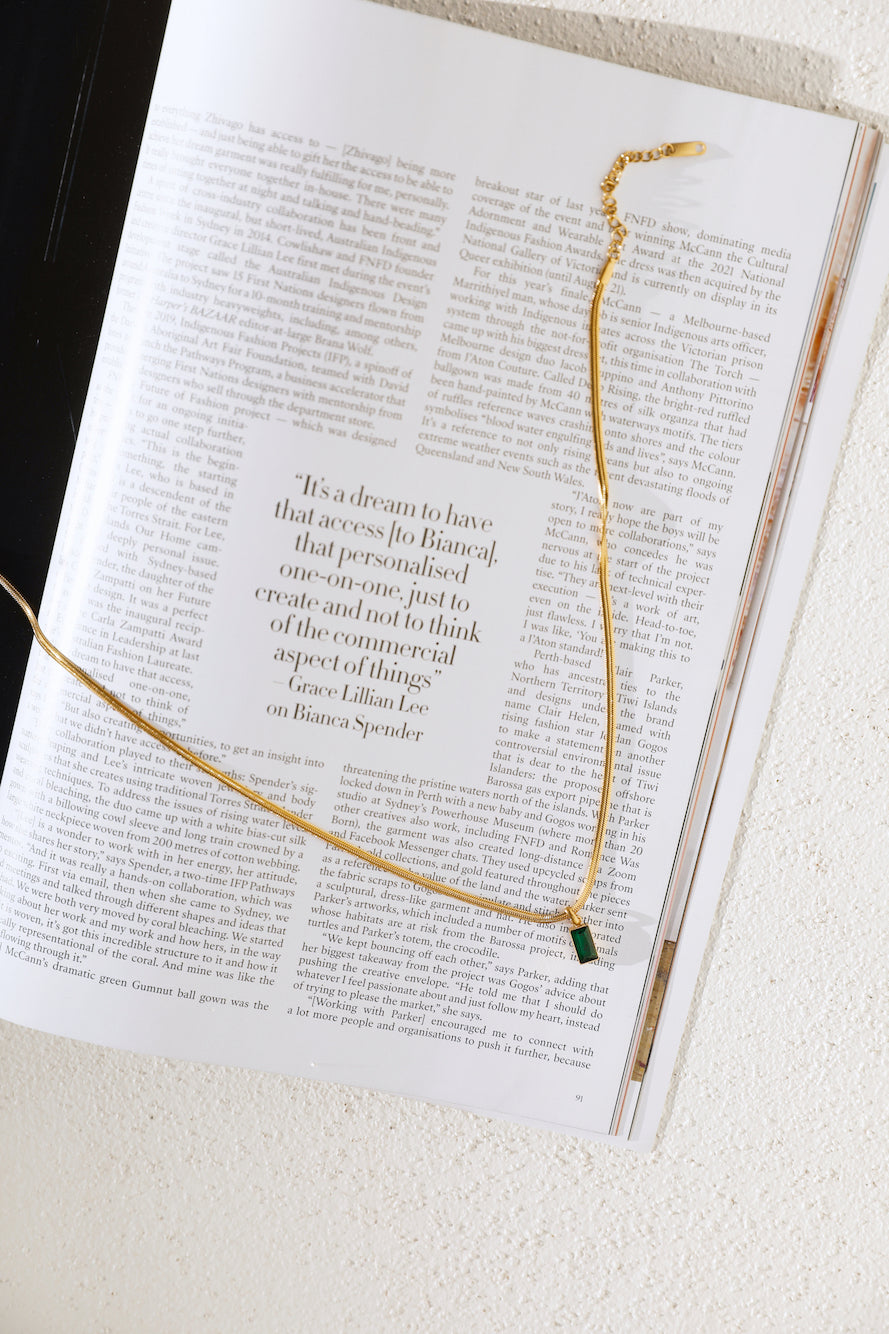 Women's gold pendant necklace — alternate angle