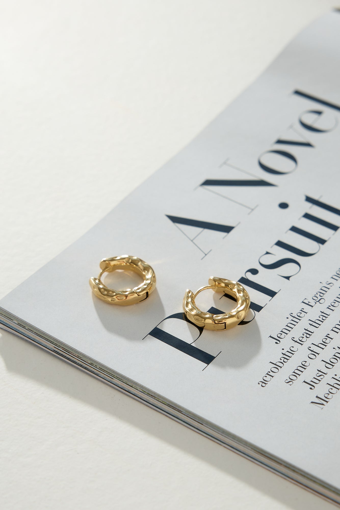 Women's gold hoop earrings — detail shot