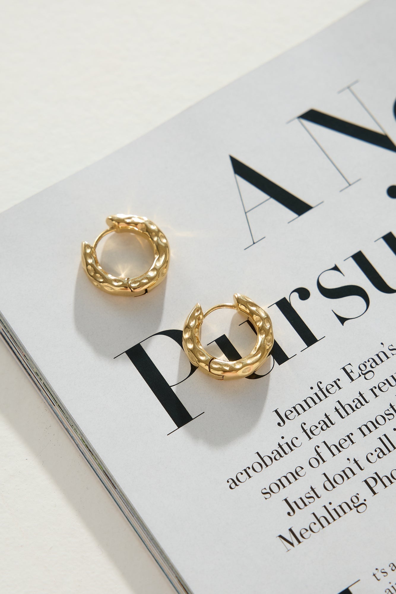 Women's gold hoop earrings — alternate angle