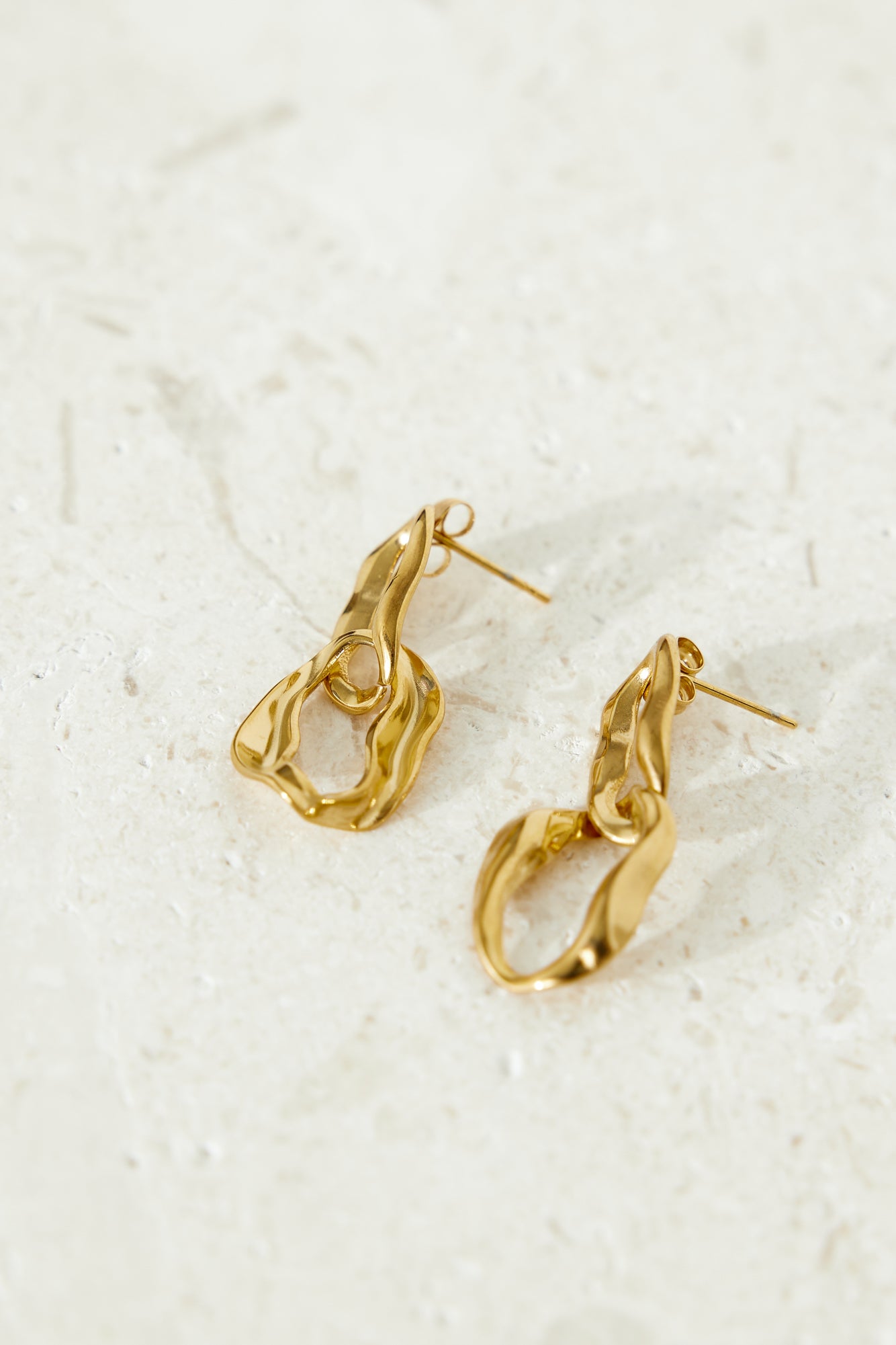 Women's gold dangle earrings — alternate angle