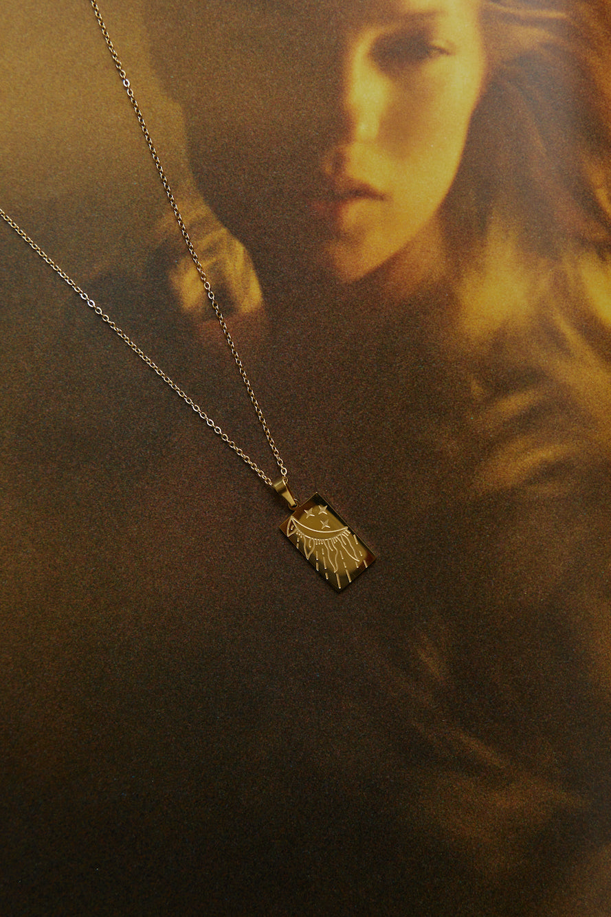 Women's gold delicate drop necklace — detail view
