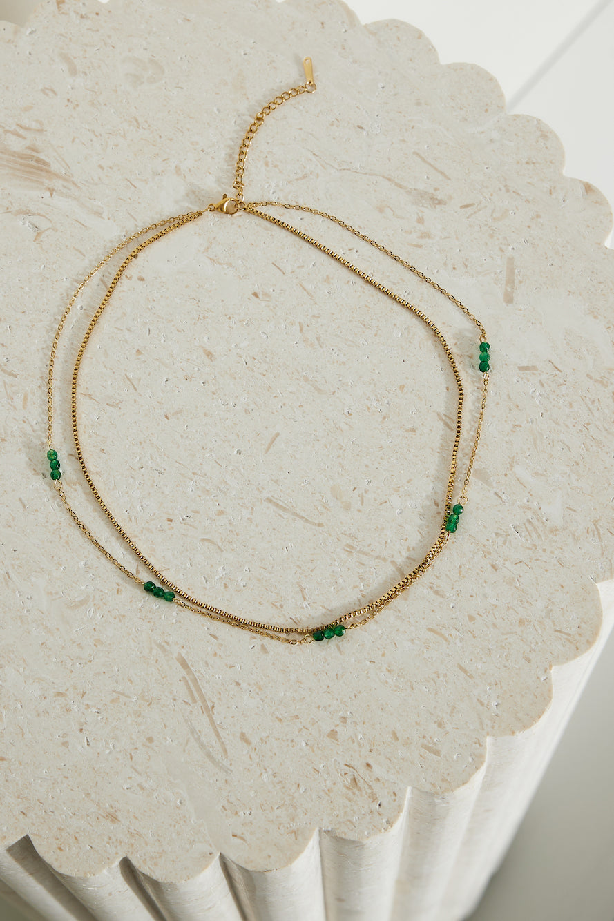 Women's gold green bead necklace — close-up detail
