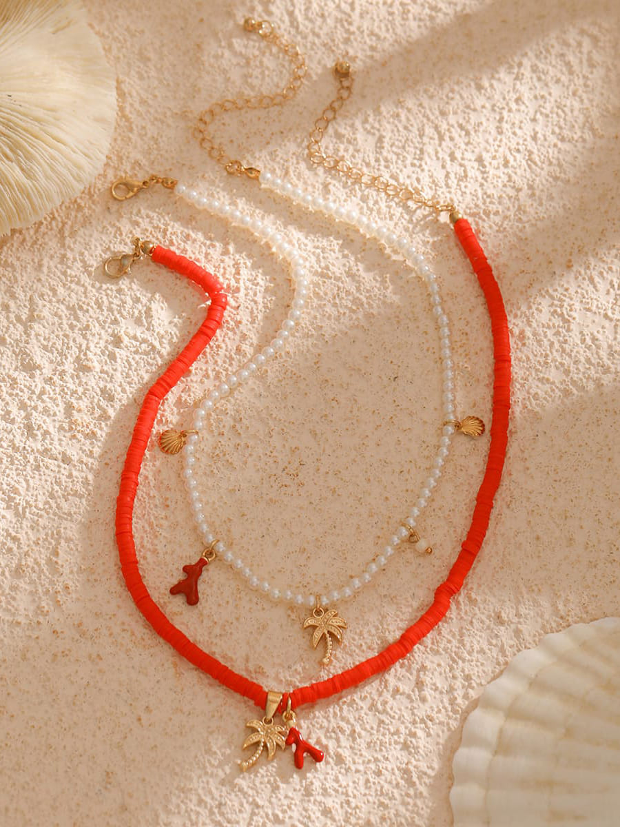 Women's gold layered pearl beach necklace — alternate angle