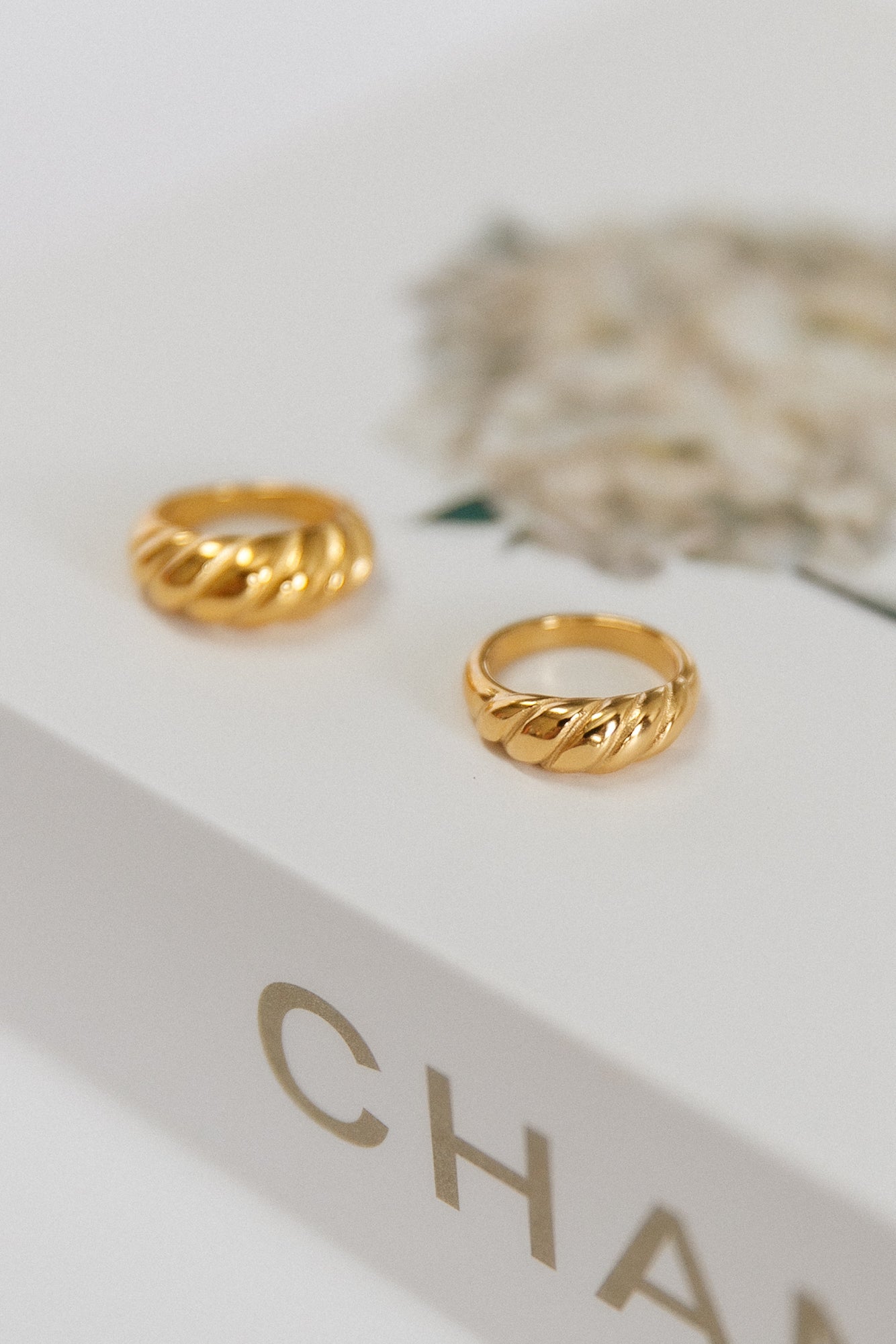 Women's gold-plated twist stacking ring — close-up detail