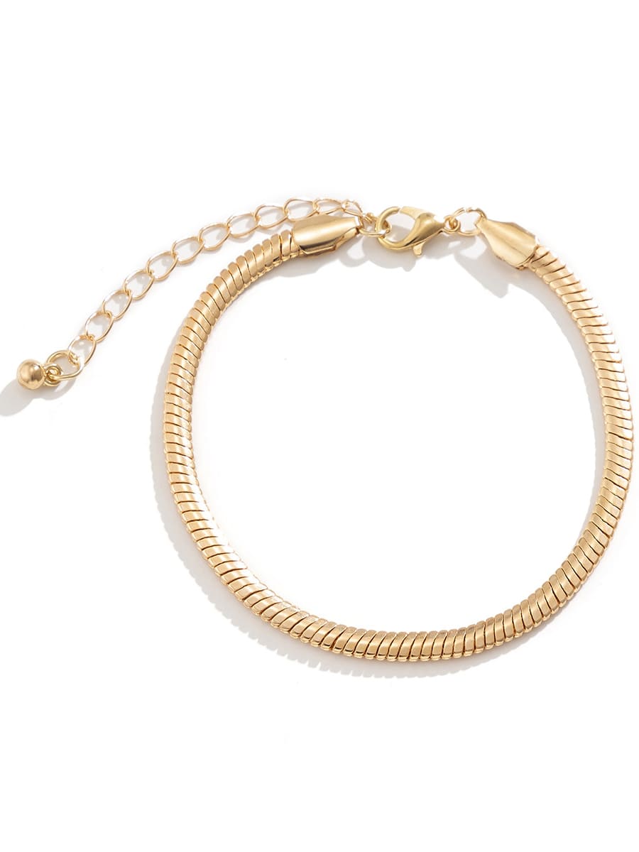 Women's gold flat snake-bone chain bracelet — alternate angle