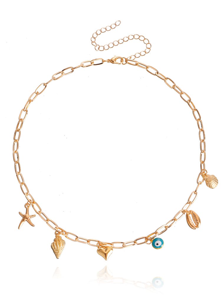 Women's gold spiral shell and seastar necklace — full length