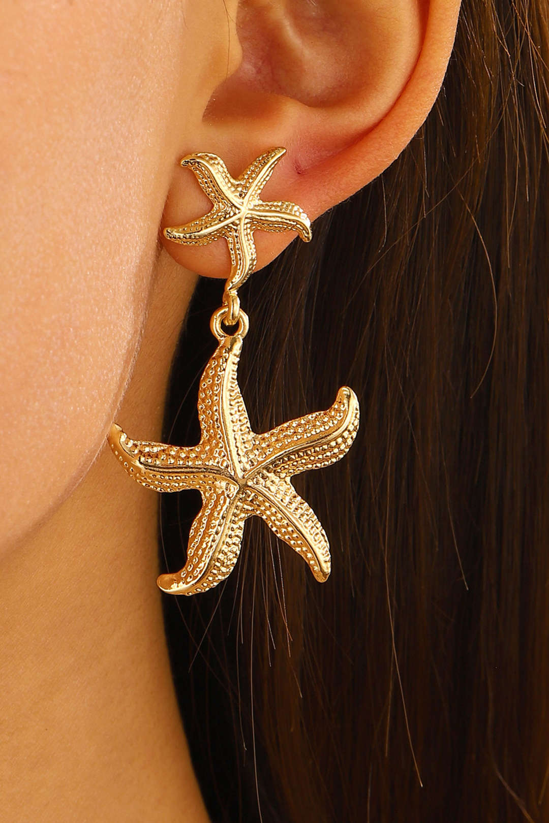 Women's gold starfish pendant earrings
