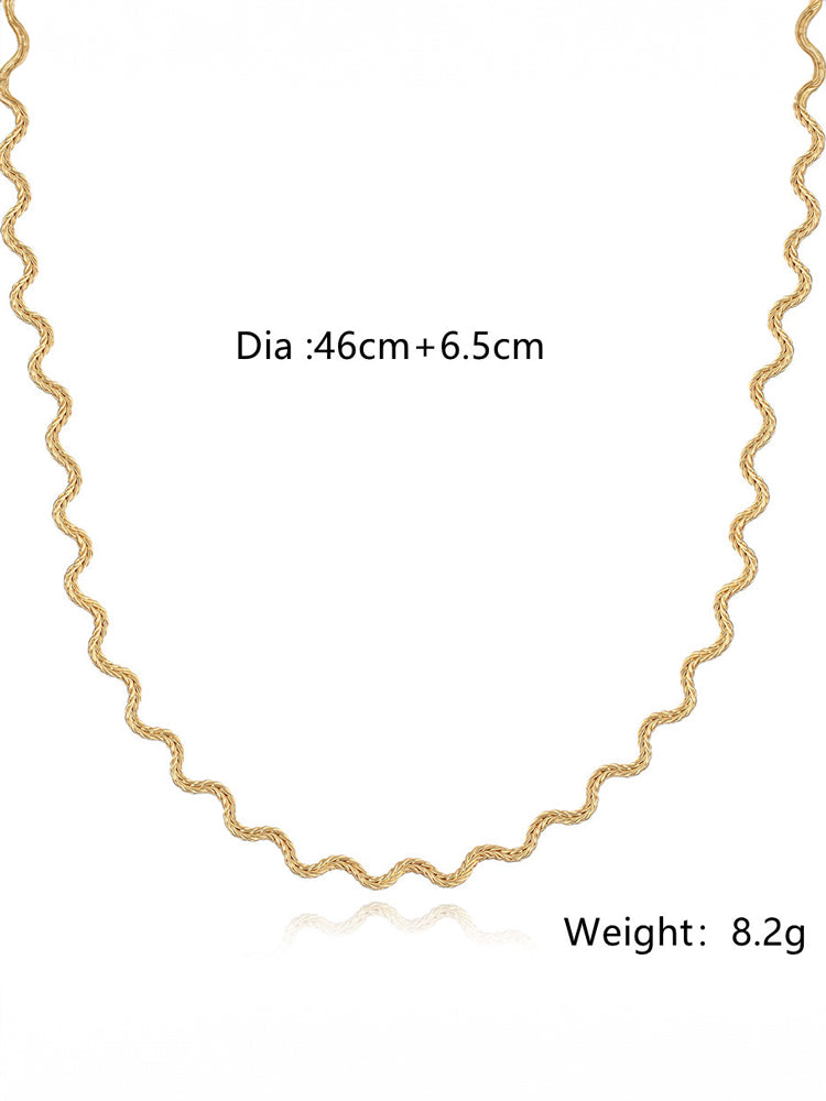 Women's chunky gold textured wave chain necklace — close-up detail
