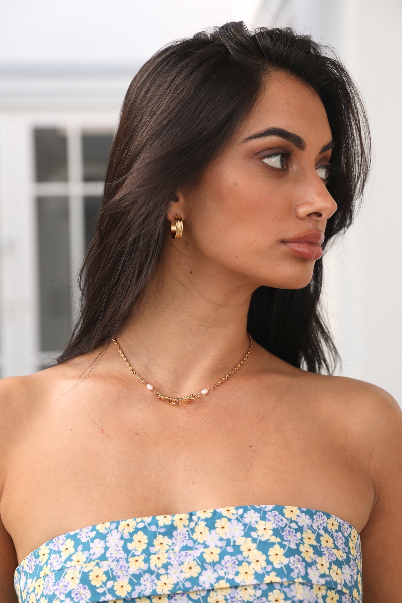 Women's gold waterproof hoop earrings — detail shot