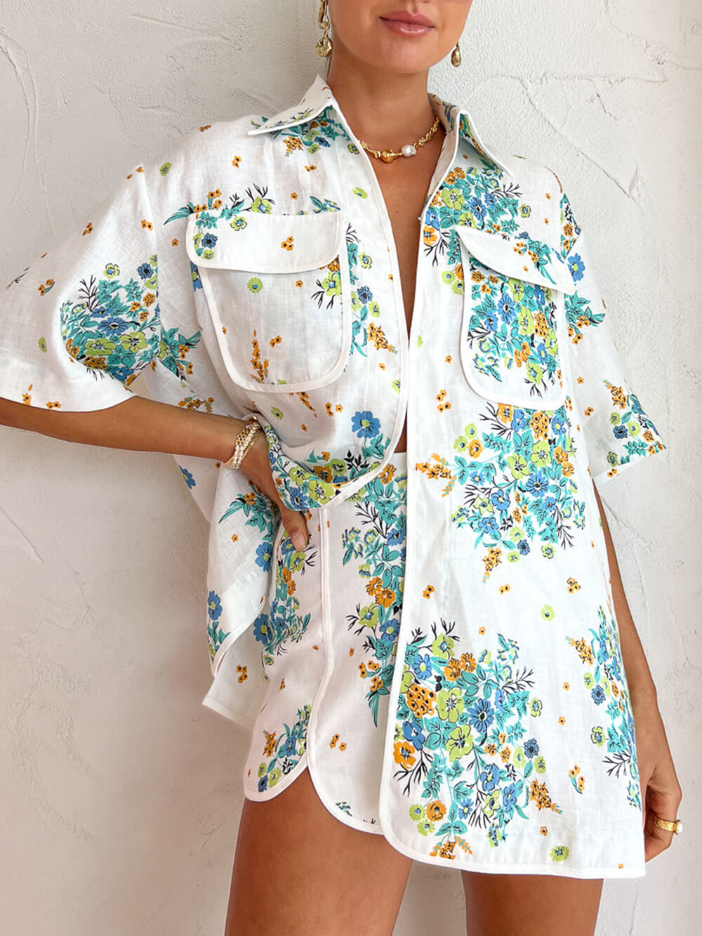 Women's green floral blouse and shorts set