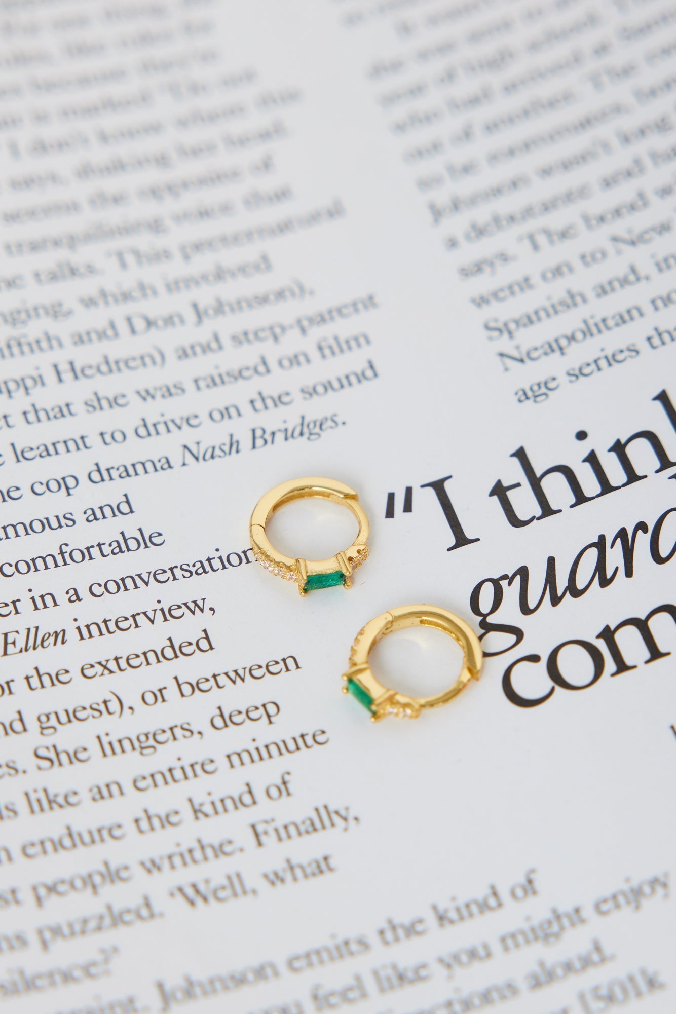 Women's green cubic zirconia hoop earrings — detail shot