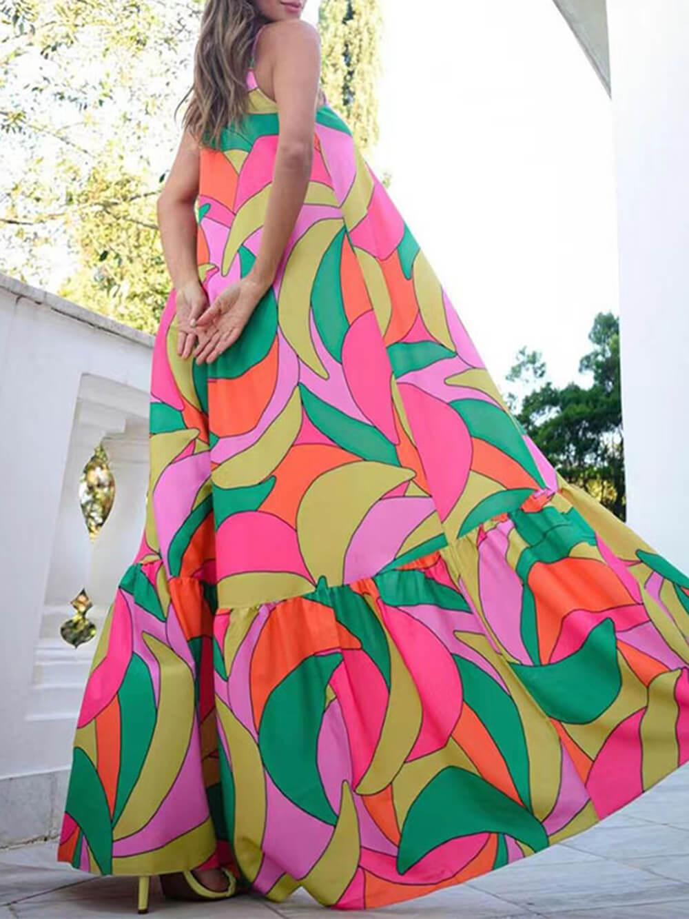 Women's printed halter maxi dress with deep V-neckline and open back — back view