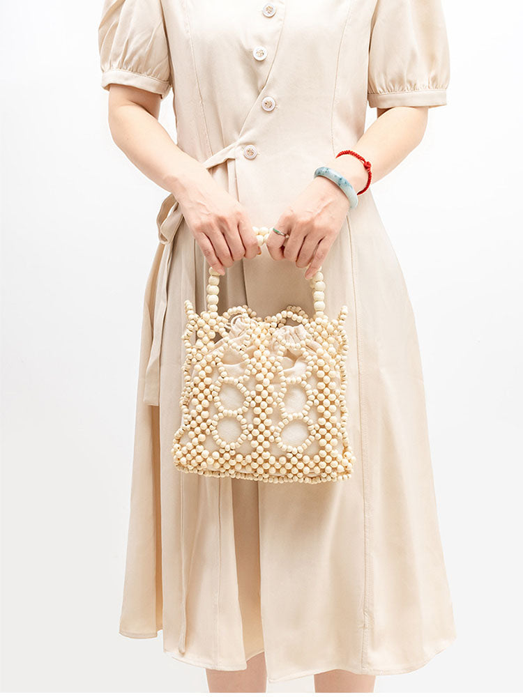 Women's handwoven wooden bead tote bag