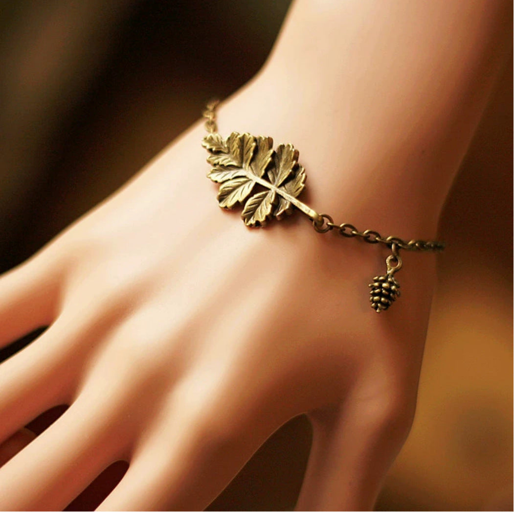 Women's nature charm bracelet — worn view