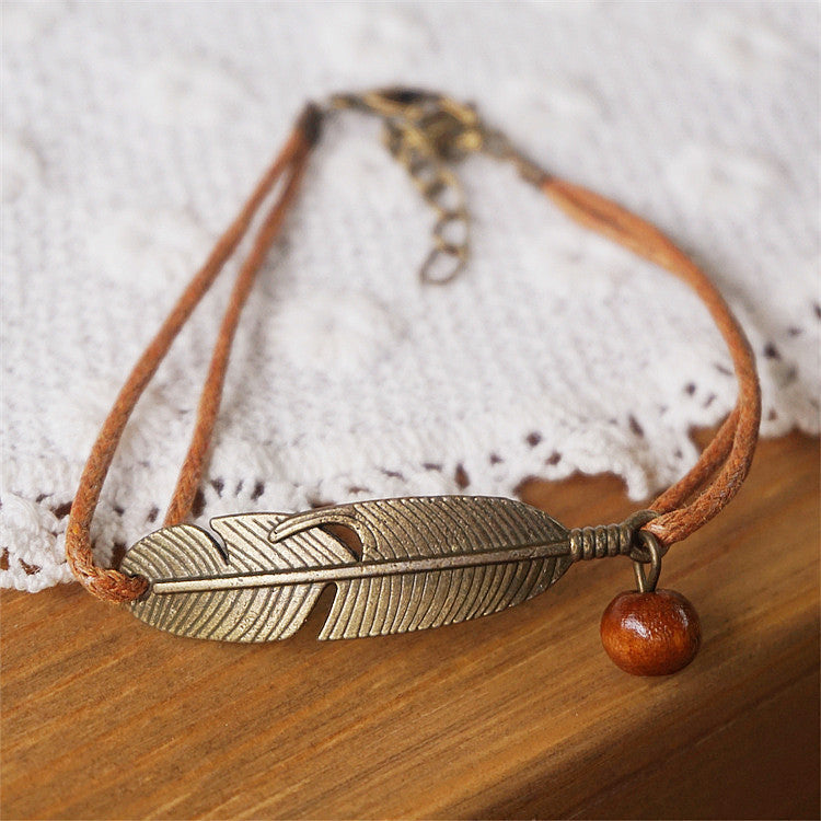 Women's nature charm bracelet — close-up detail