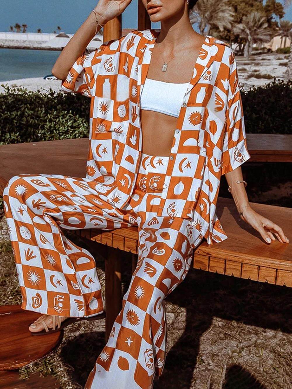 Women's orange tropical print wide-leg trousers — full length
