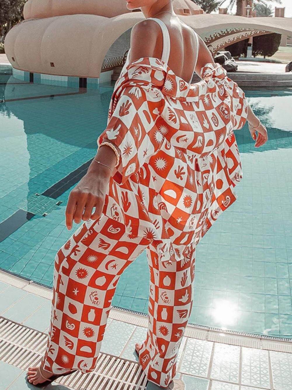 Women's orange tropical print wide-leg trousers — side detail