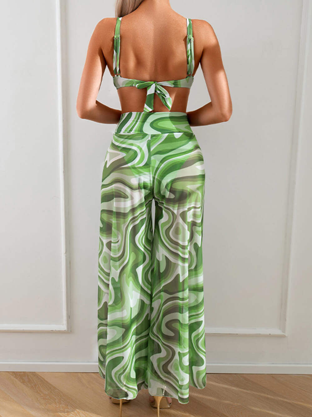 Women's printed bikini and trousers co-ord set — green colourway styled