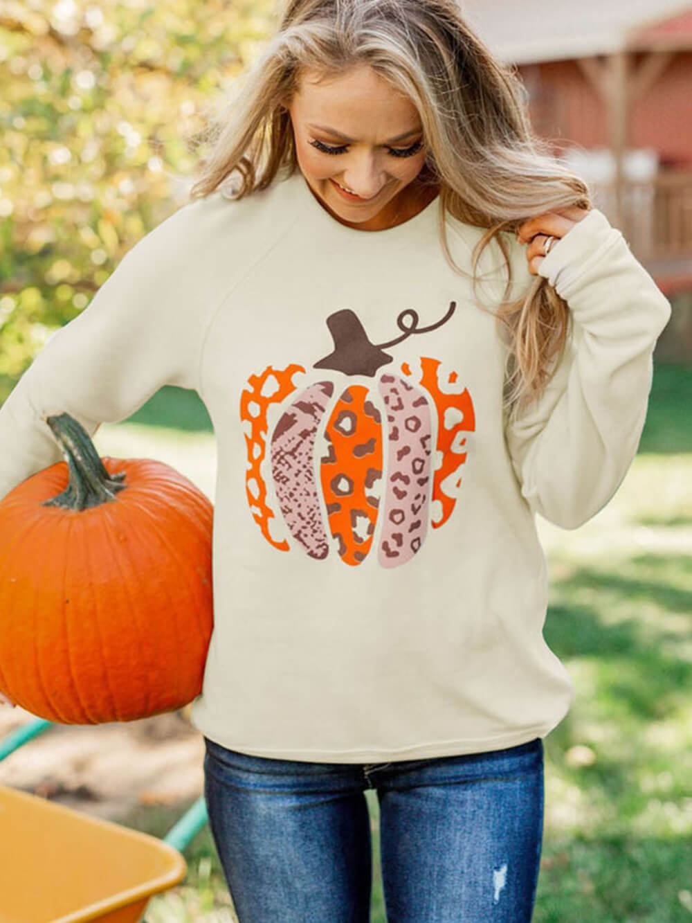 Women's pumpkin print graphic pullover — back view