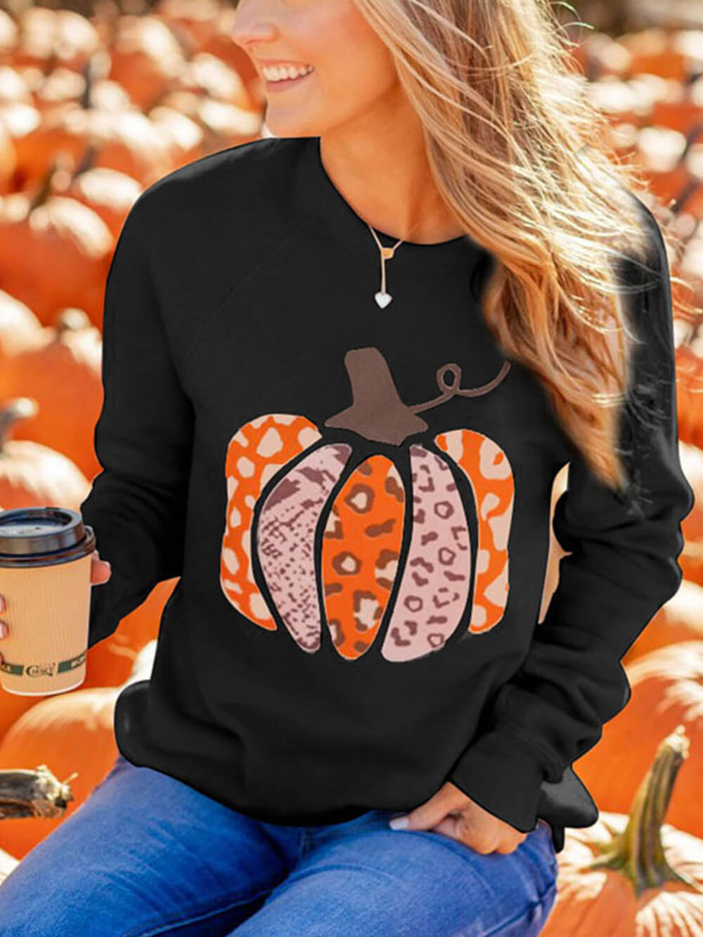 Women's pumpkin print graphic pullover — side detail
