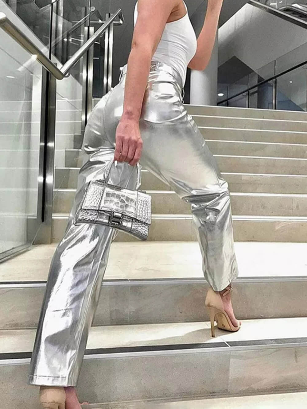 Women's silver faux leather trousers — side view