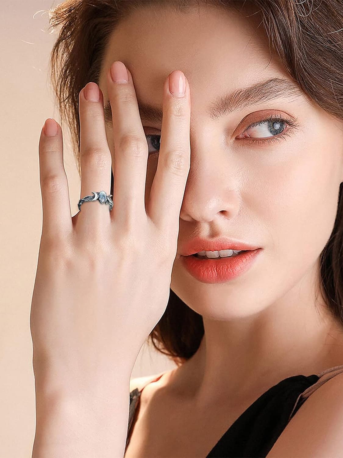 Women's silver triple moon phase ring — worn view