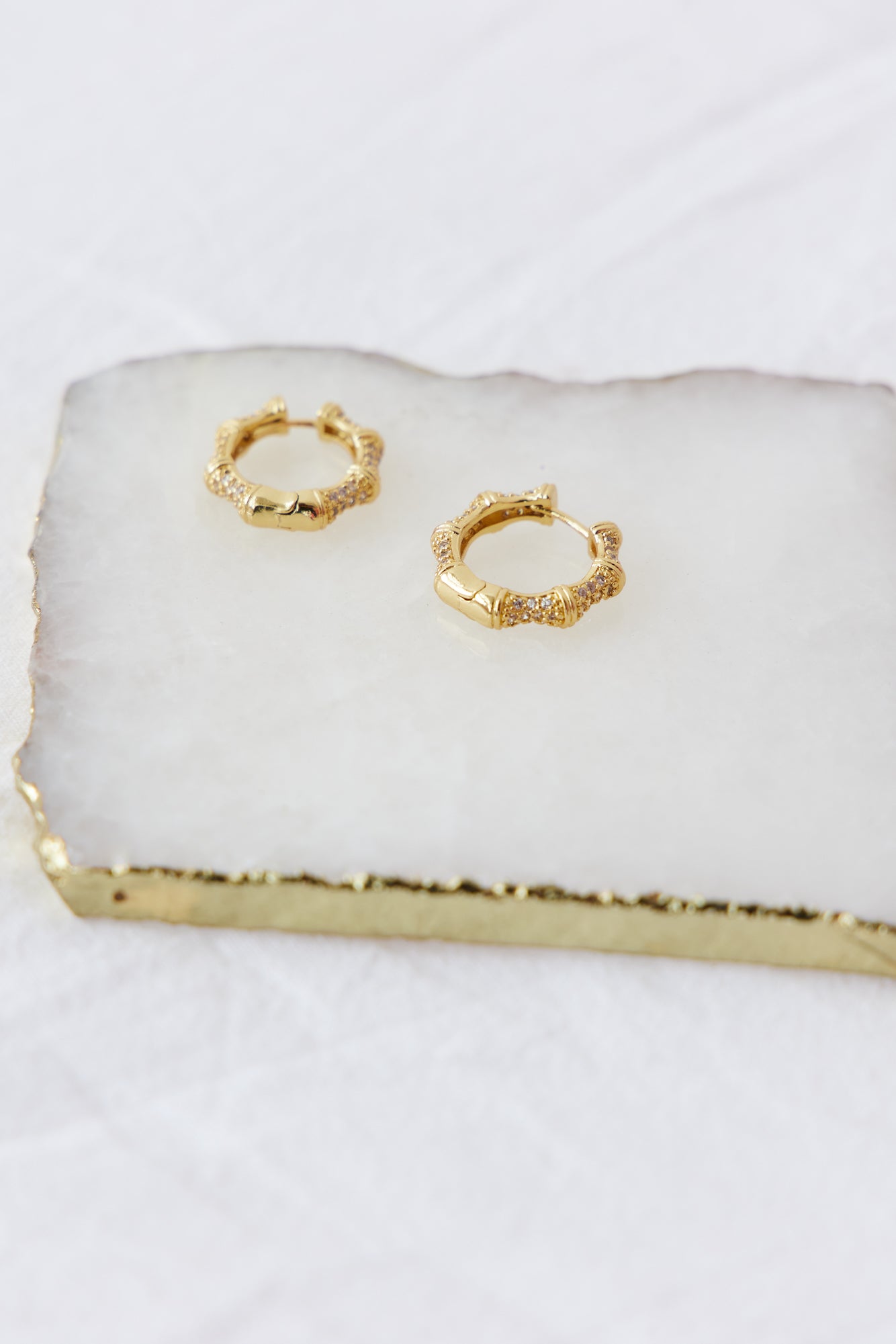 Women's small gold hoop earrings — alternate angle