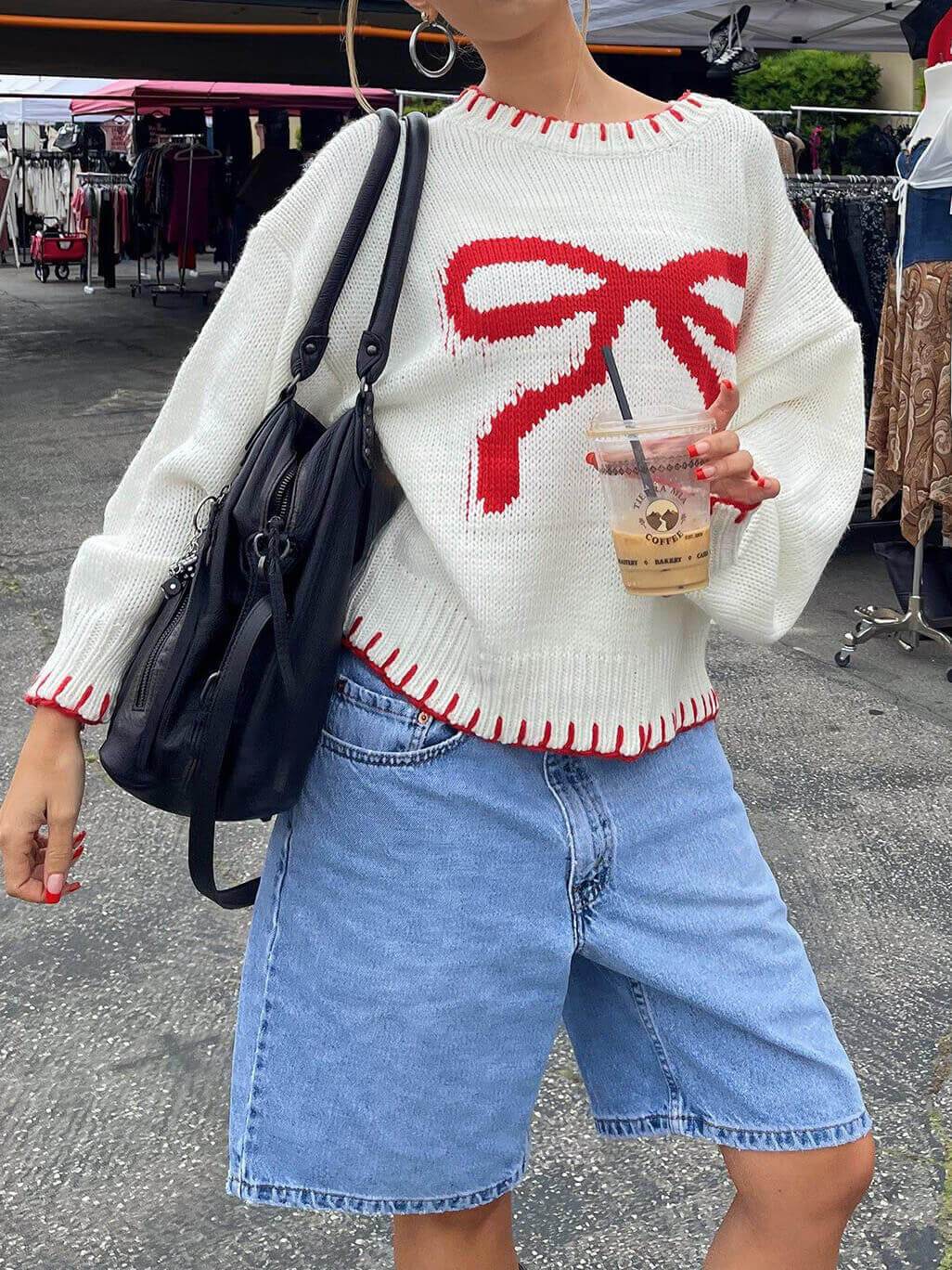 Women's white bow jacquard sweater — detail view
