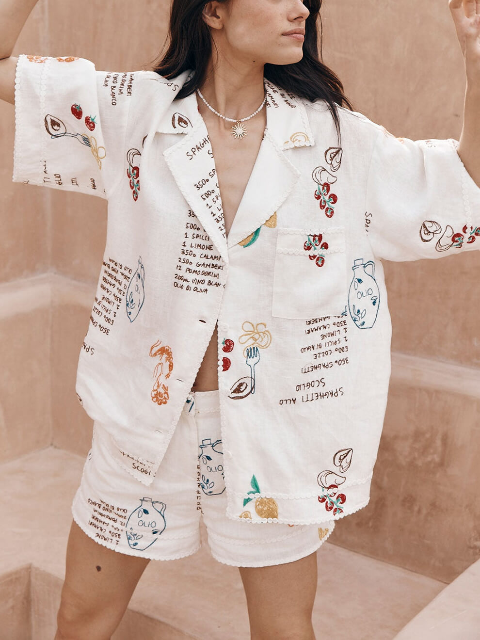 Women's white cardigan and shorts co-ord set