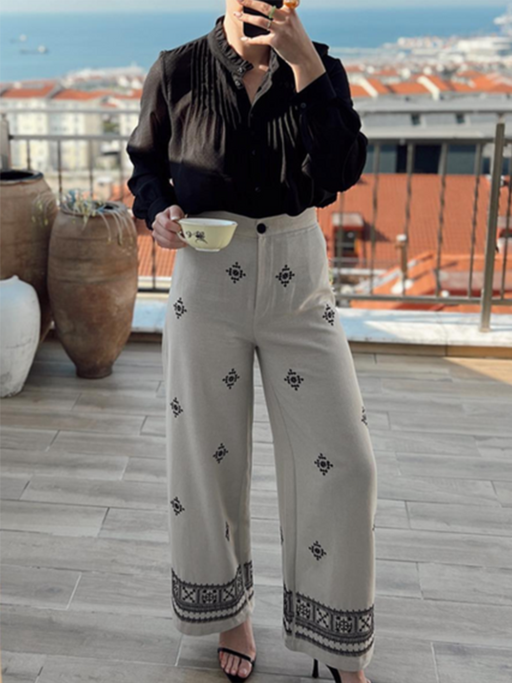 Women's white geometric embroidered wide-leg trousers — detail view